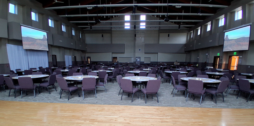 Parish Hall rental space set with tables, chairs and projectors